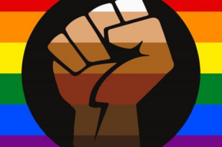 LGBTQ Flag with gradient fist in front of it