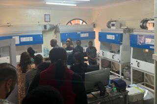 Participants observe specialized hoods for experiments that require additional safety