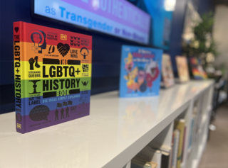 LGBTQ History Book sitting on bookshelf in Yale LGBTQ Center