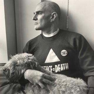 Larry Kramer wearing a Silence=Death shirt